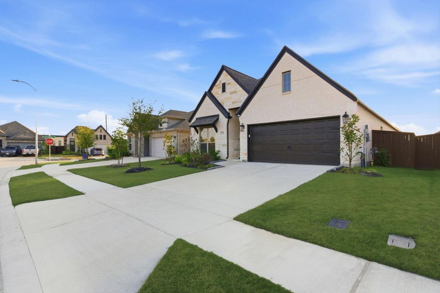 Front exterior of a new home in Meridiana 40'/45', Manvel, TX, highlighting curb appeal (Image 26).