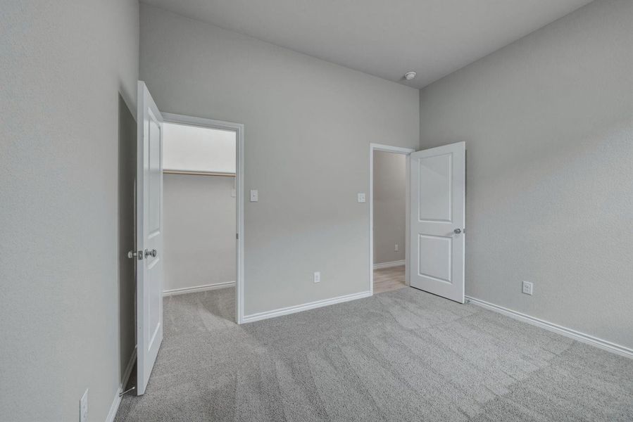 Bedroom in the Cedar home plan by Trophy Signature Homes – REPRESENTATIVE PHOTO
