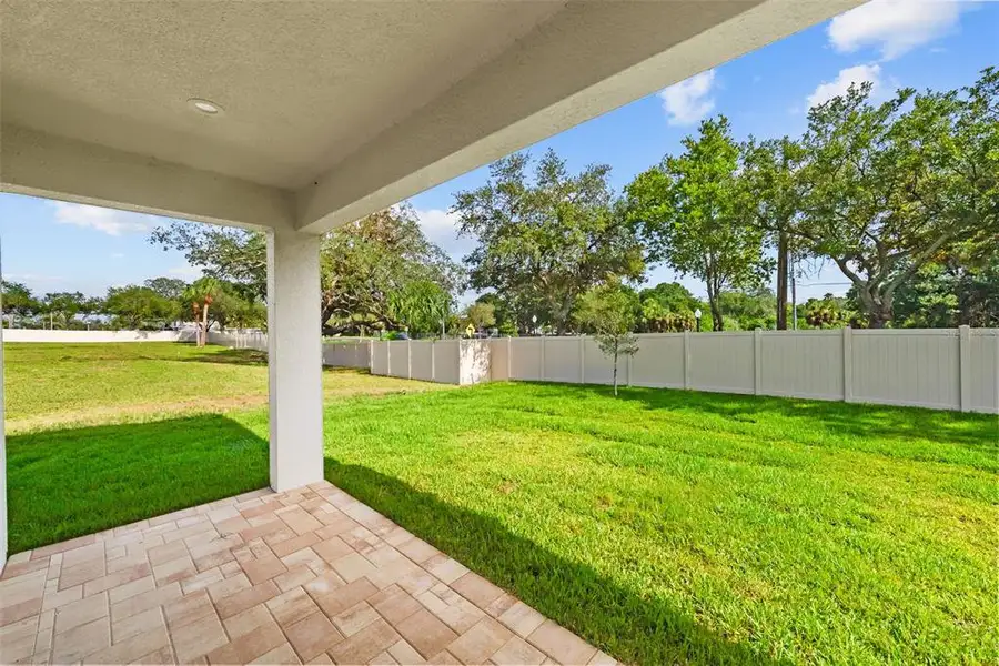 Exterior details and patio area of a home in , Tarpon Springs (Image 29).