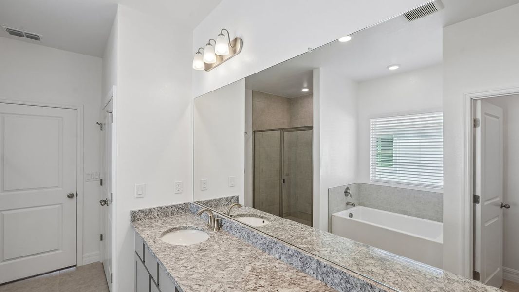Furnished interior view inside a new home in Heritage Station, Punta Gorda (Image 11).