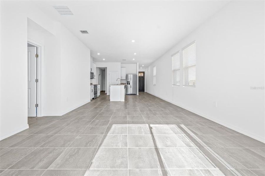 Spacious, unfurnished interior of a new home in The Grove at Stuart Crossing - Premier Series, Bartow (Image 16).