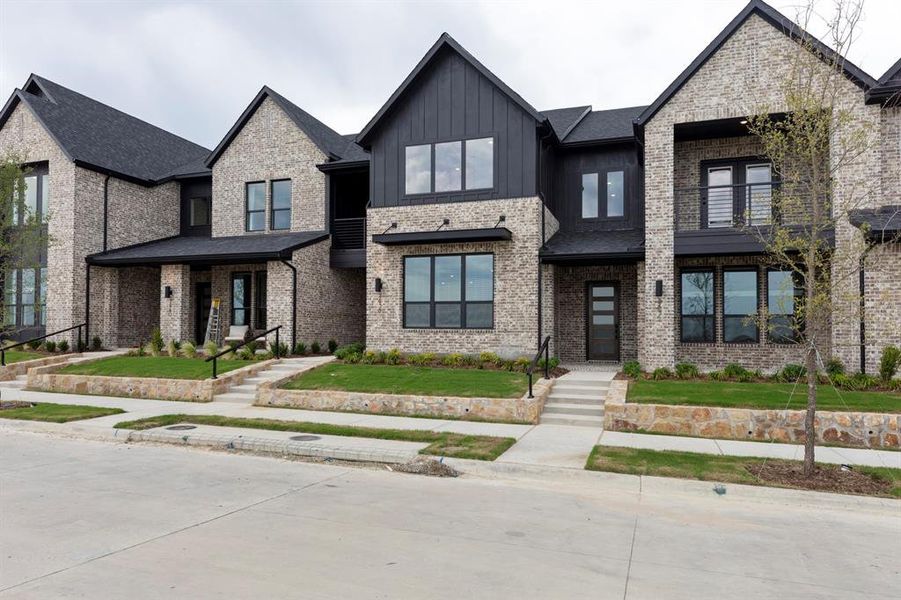 Front exterior of a new home in Ridgeline Towns, McKinney, TX, highlighting curb appeal (Image 26). Front exterior of a new home in Ridgeline Towns, McKinney, TX, highlighting curb appeal (Image 26).