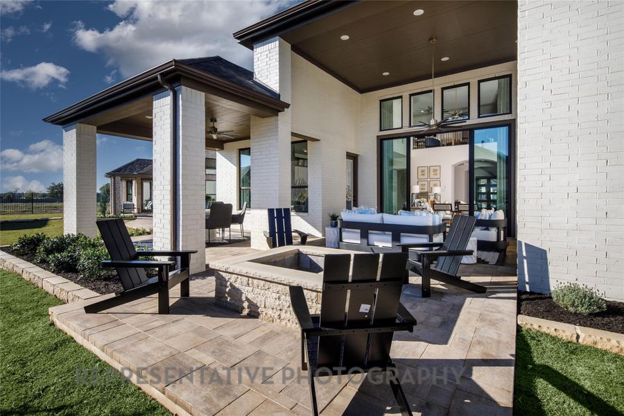 View of patio / terrace featuring an outdoor fire pit and ceiling fan