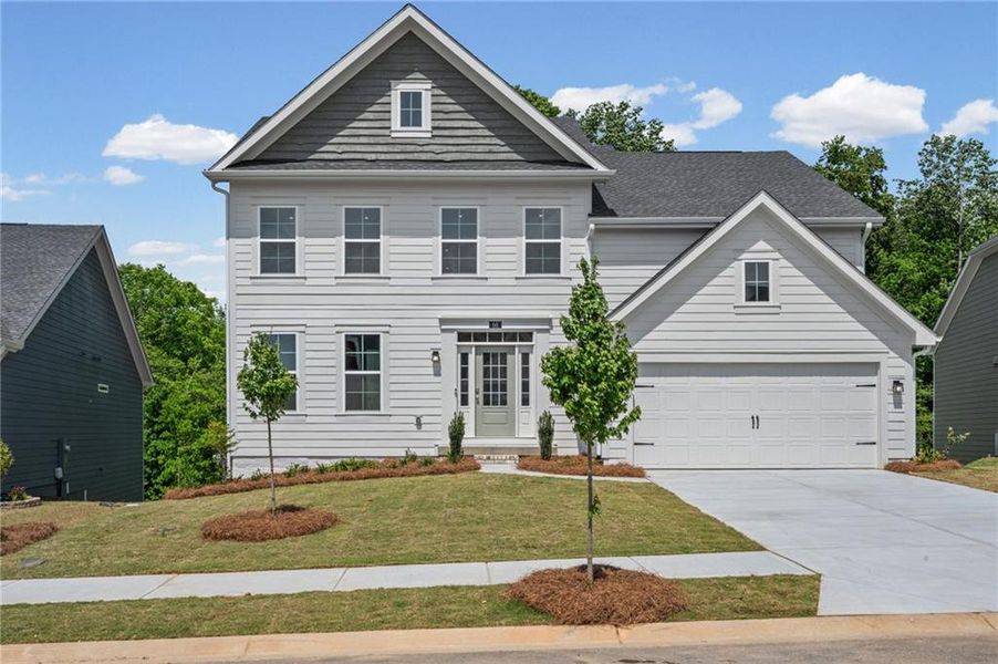 Front exterior of a new home in The Reserve At Liberty Park, Braselton, GA, highlighting curb appeal (Image 24). Front exterior of a new home in The Reserve At Liberty Park, Braselton, GA, highlighting curb appeal (Image 24).