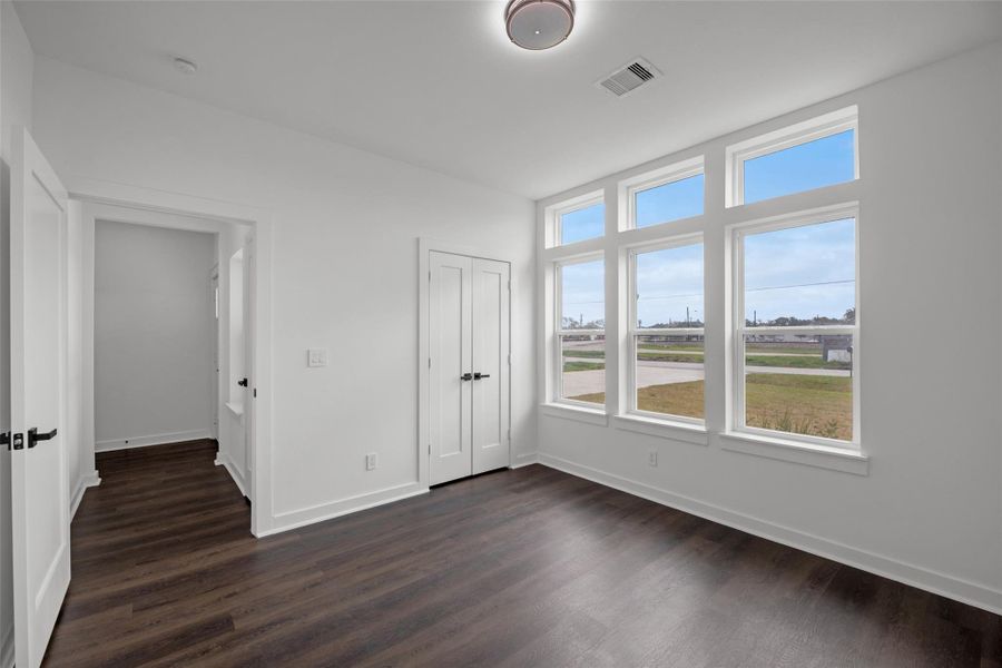 Double-door closet and adjacent hallway add functionality and space. Double-door closet and adjacent hallway add functionality and space.