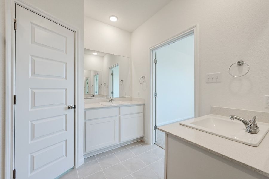 Primary Bath in the Cedar home plan by Trophy Signature Homes – REPRESENTATIVE PHOTO