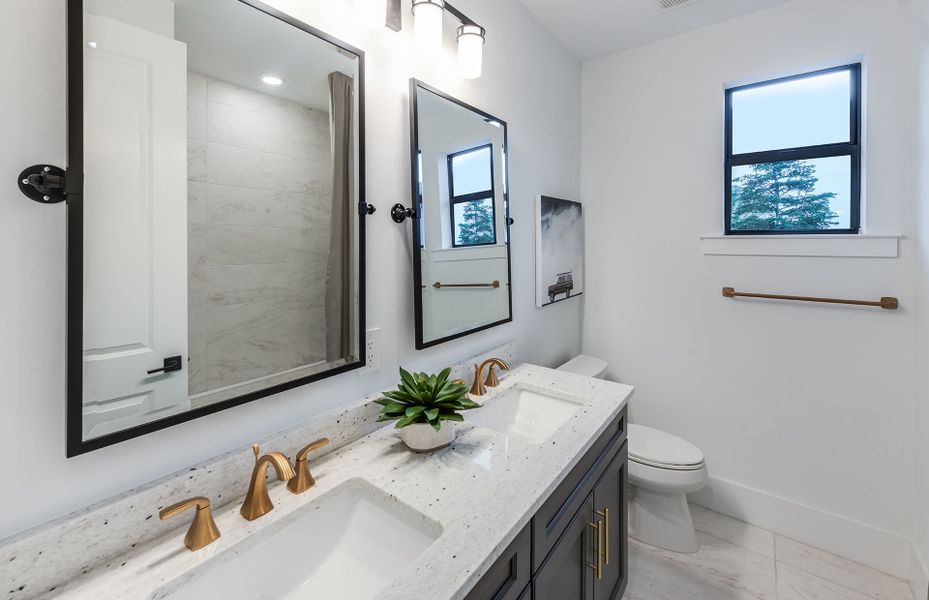 Representative furnished interior of a home built from the Sanibel by DiVosta in Orchid Isles, Palm Beach Gardens (Image 9).
