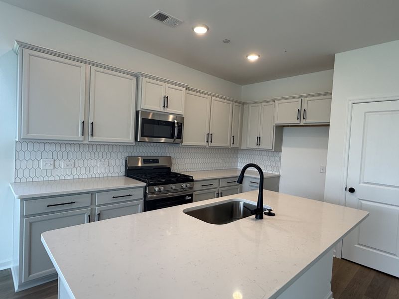 Furnished interior view inside a new home in Nexus Townhomes, Gallatin (Image 7).