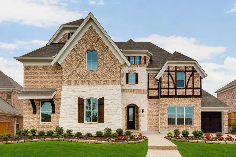 Representative exterior photo of a completed home built from the Downton Abbey - 3 Car Garage by Grand Homes in Heath Golf & Yacht Club, Heath, TX (Image 1). Representative exterior photo of a completed home built from the Downton Abbey - 3 Car Garage by Grand Homes in Heath Golf & Yacht Club, Heath, TX (Image 1).