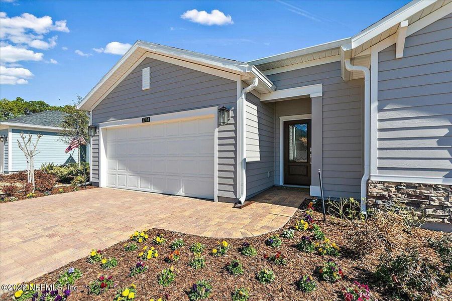 Exterior details and patio area of a home in Edenbrooke at Hyland Trail | 55+, Green Cove Springs (Image 4).