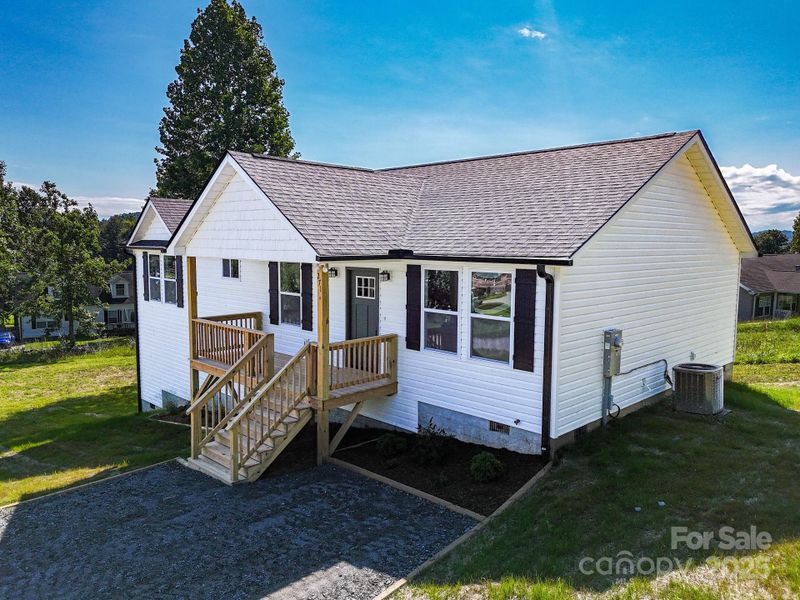 Front exterior of a new home in , Hendersonville, NC, highlighting curb appeal (Image 2).