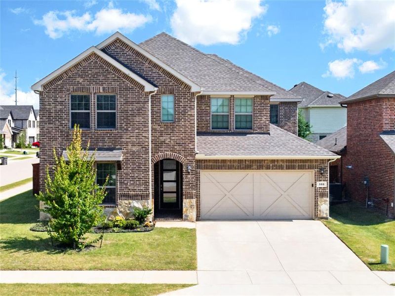 Front exterior of a new home in , Little Elm, TX, highlighting curb appeal (Image 1). Front exterior of a new home in , Little Elm, TX, highlighting curb appeal (Image 1).
