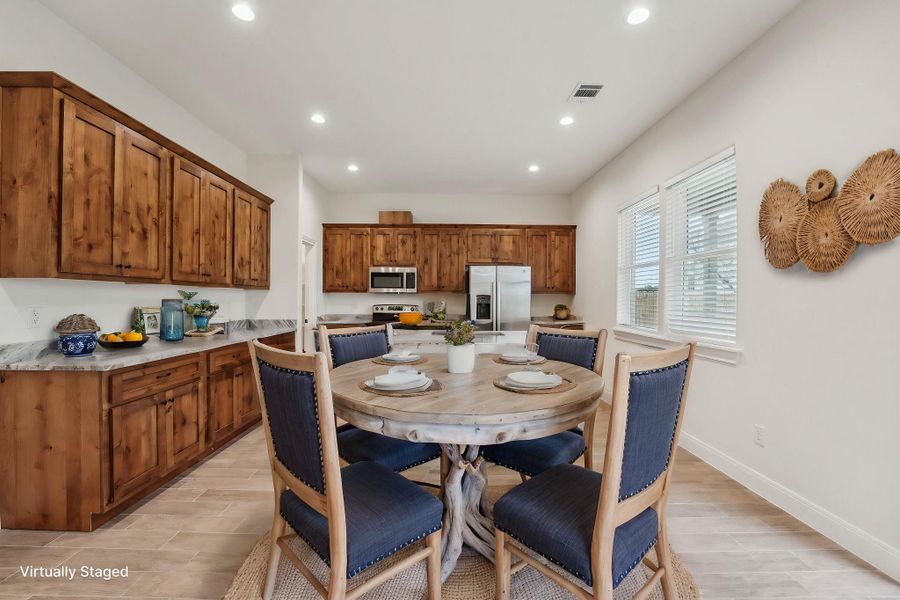 Virtually Staged Dining room with visible vents, recessed lighting, baseboards, and wood plank tile floor Virtually Staged Dining room with visible vents, recessed lighting, baseboards, and wood plank tile floor