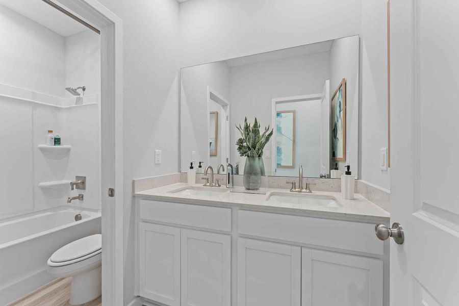 Laurel II Model Home Guest Bath with Dual Vanity Sink and Tub and Shower at Camden Woods in Kingsland, GA