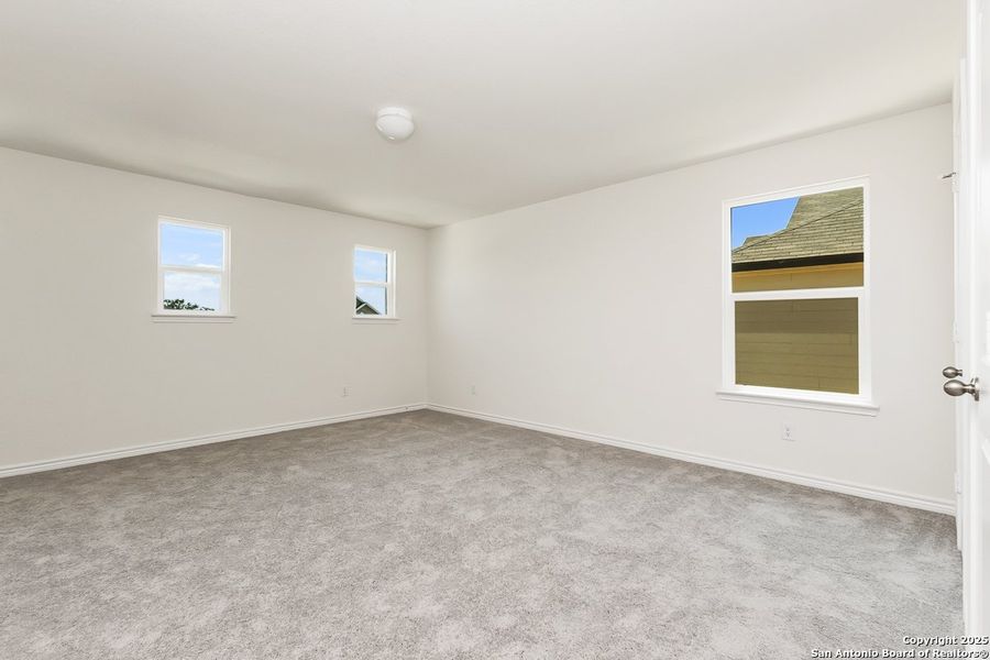 Spacious, unfurnished interior of a new home in Hidden Bluffs at TRP, San Antonio (Image 5).