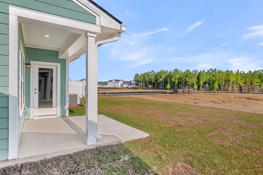 Exterior details and patio area of a home in Tea Farm, Ravenel (Image 4). Exterior details and patio area of a home in Tea Farm, Ravenel (Image 4).