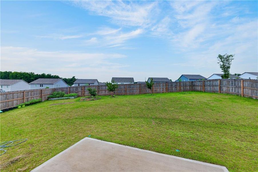 Exterior details and patio area of a home in Glen at Kensington, Lithia Springs (Image 26).