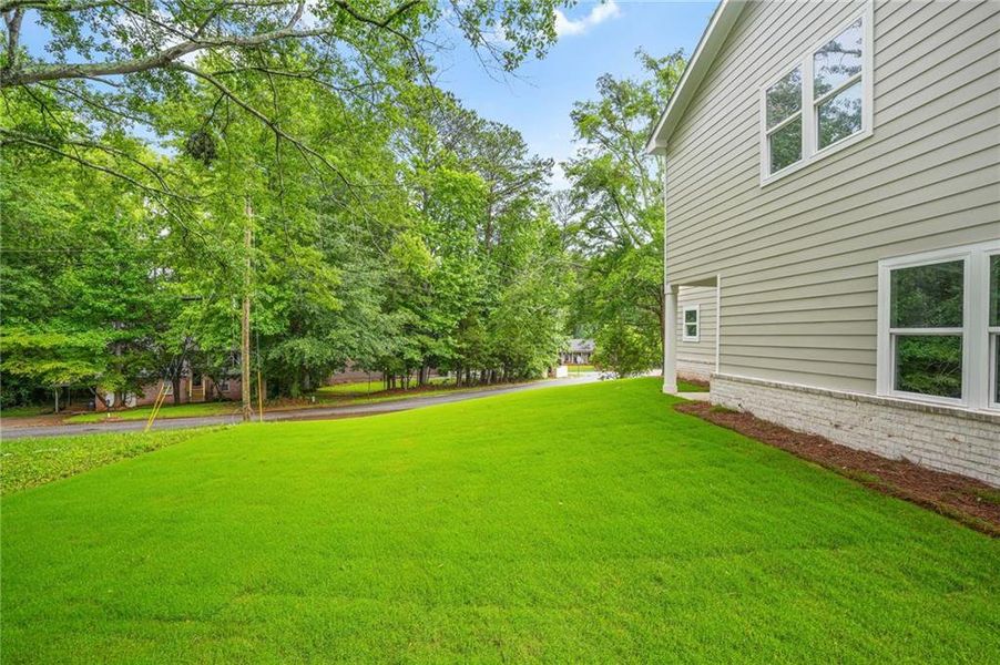 Front exterior of a new home in , Stockbridge, GA, highlighting curb appeal (Image 32).