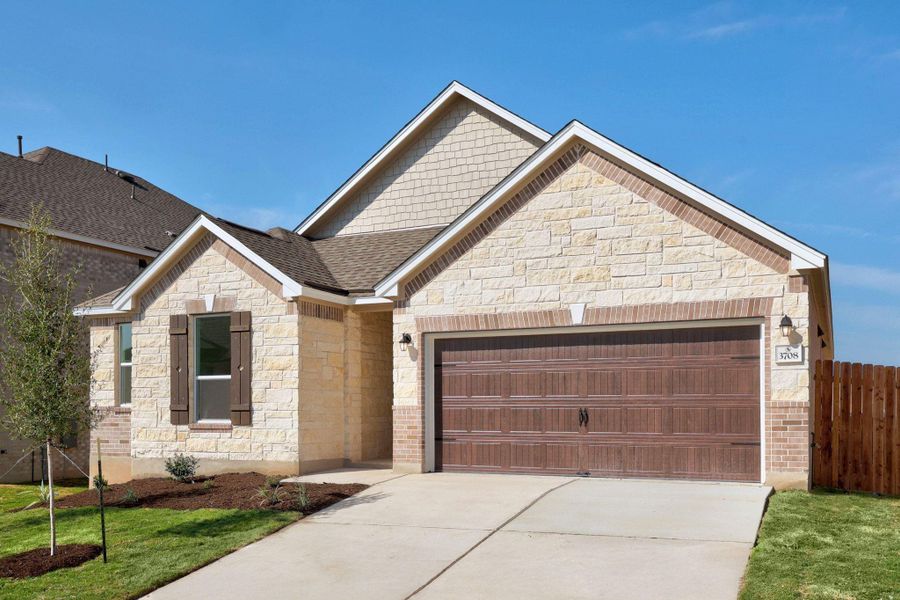 Front exterior of a new home in Salerno - Classic Collection, Round Rock, TX, highlighting curb appeal (Image 16).