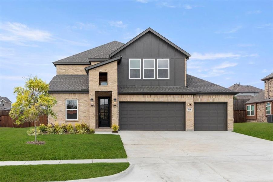 Front exterior of a new home in Grayhawk Addition, Forney, TX, highlighting curb appeal (Image 1).