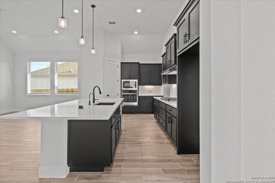 Furnished interior view inside a new home in Village at Three Oaks, Seguin (Image 7).