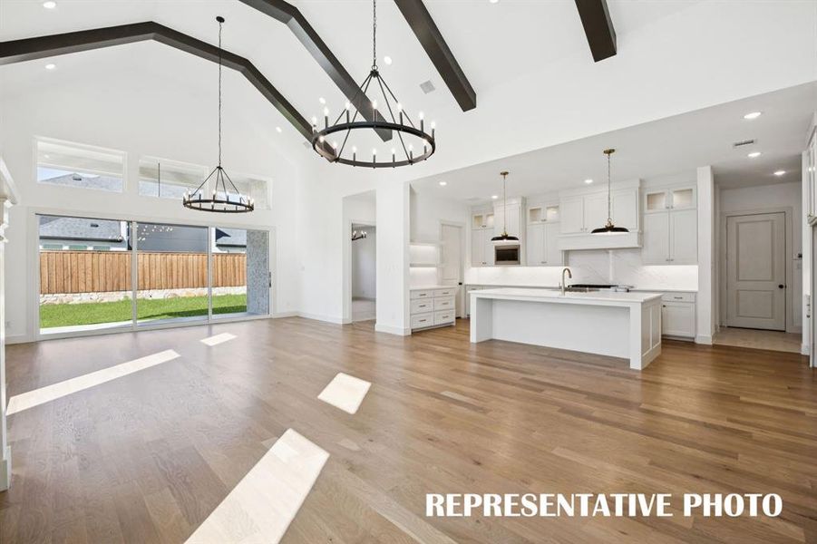 The open and flowing family-kitchen-dining area was designed for elegant entertaining!  REPRESENTATIVE PHOTO