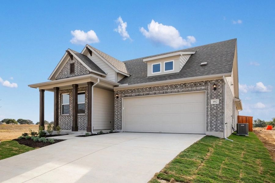 Front exterior of a new home in Berry Creek Highlands, Georgetown, TX, highlighting curb appeal (Image 26).