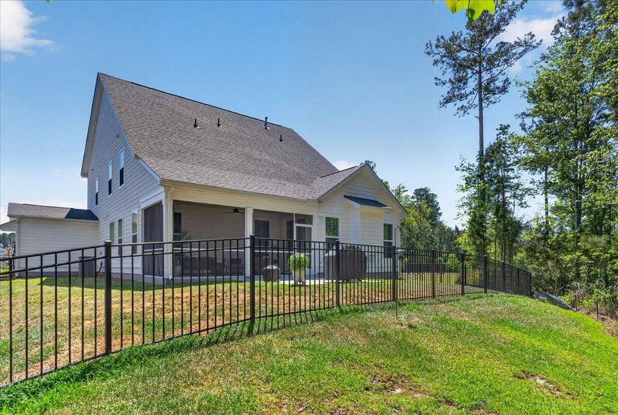 Exterior details and patio area of a home in Tidewater at Lakes of Cane Bay, Summerville (Image 29).