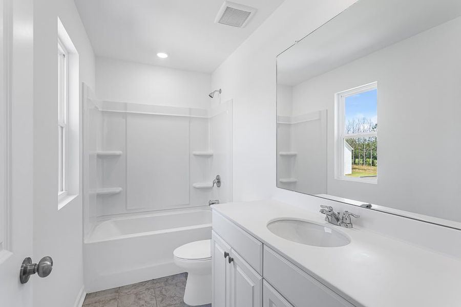 Representative furnished interior of a home built from the Avera by Taylor Morrison in Falls Creek, Flowery Branch (Image 11).