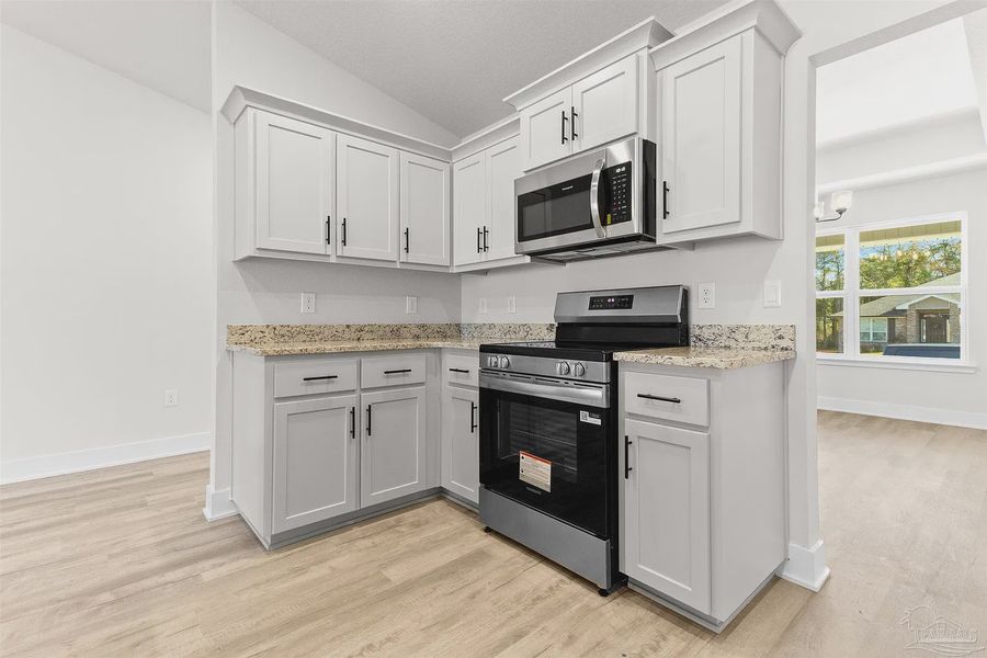 Furnished interior view inside a new home in Pecan Valley, Pensacola (Image 5).