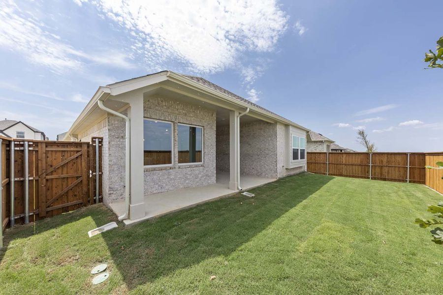 Exterior details and patio area of a home in Creekview Meadows, Pilot Point (Image 24).