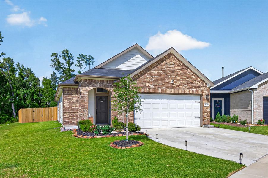 This charming brick home features a neatly landscaped front yard, a welcoming front porch, and a spacious two-car garage. It offers a well-maintained driveway and a fenced backyard, ideal for privacy and outdoor activities. This charming brick home features a neatly landscaped front yard, a welcoming front porch, and a spacious two-car garage. It offers a well-maintained driveway and a fenced backyard, ideal for privacy and outdoor activities.