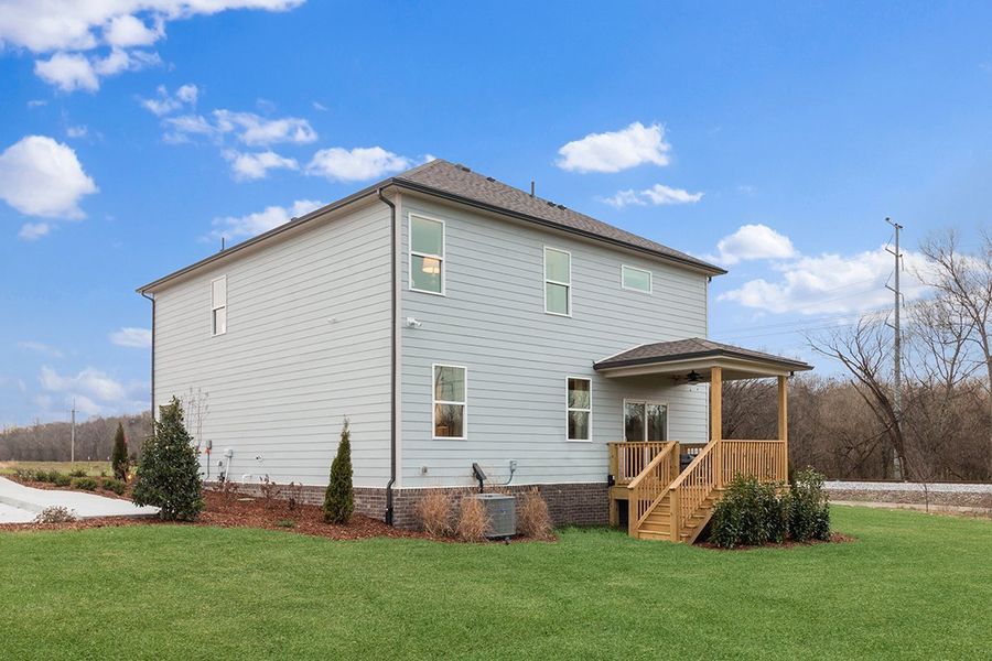 A house with a yard and a fence.