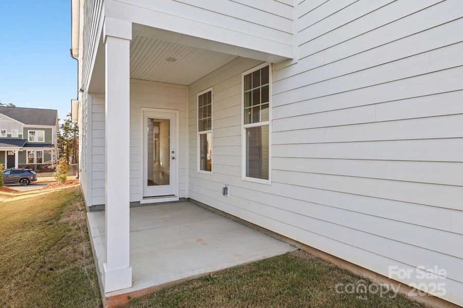 Exterior details and patio area of a home in Edgewood Preserve, Huntersville (Image 23).