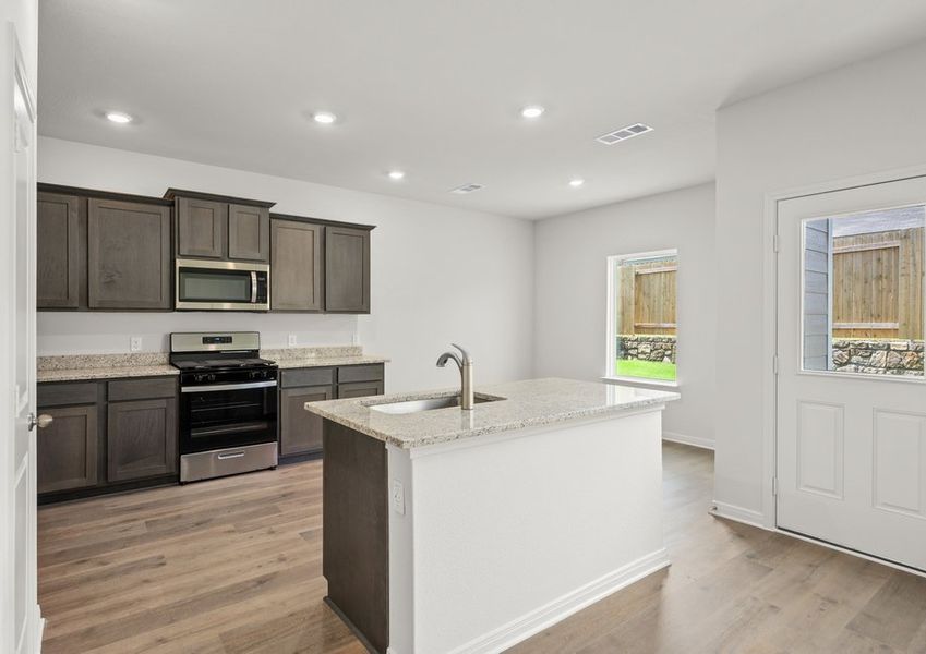 The kitchen has sprawling granite countertops. The kitchen has sprawling granite countertops.