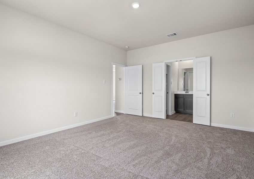 The master suite has a large bedroom, ensuite bathroom and a walk-in closet.