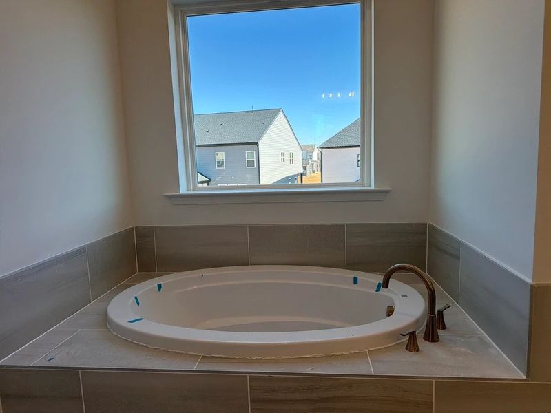 Primary Bath featuring the AW Collection® Sapphire - Clean white and cool hues define the space.