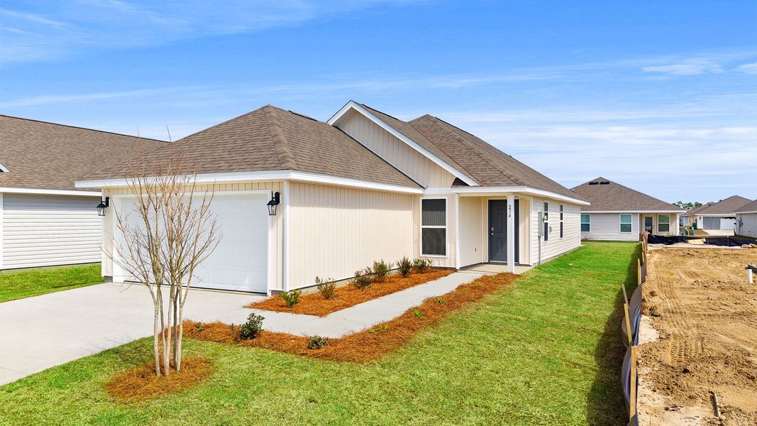Front exterior of a new home in Park Place, Panama City, FL, highlighting curb appeal (Image 1). Front exterior of a new home in Park Place, Panama City, FL, highlighting curb appeal (Image 1).