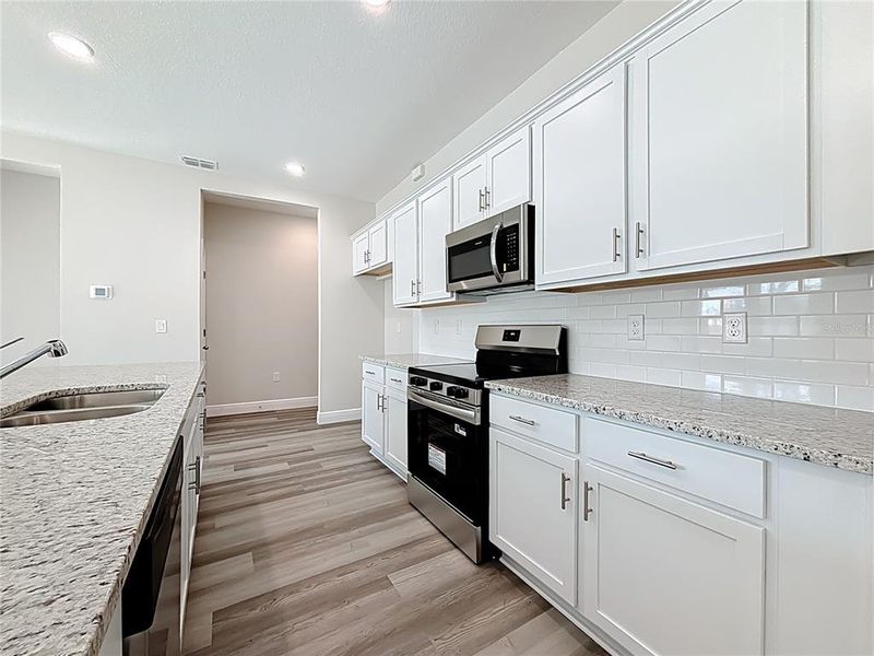 Furnished interior view inside a new home in , North Port (Image 9).