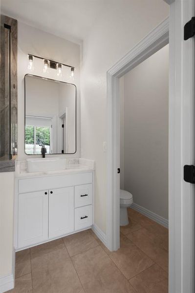 Bathroom featuring vanity and light tile patterned flooring