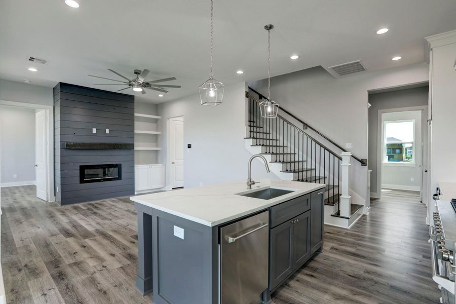 Primary bedroom and guest suite along with the utility room, butlers station and a half bath join the kitchen & main level living area. Primary bedroom and guest suite along with the utility room, butlers station and a half bath join the kitchen & main level living area.