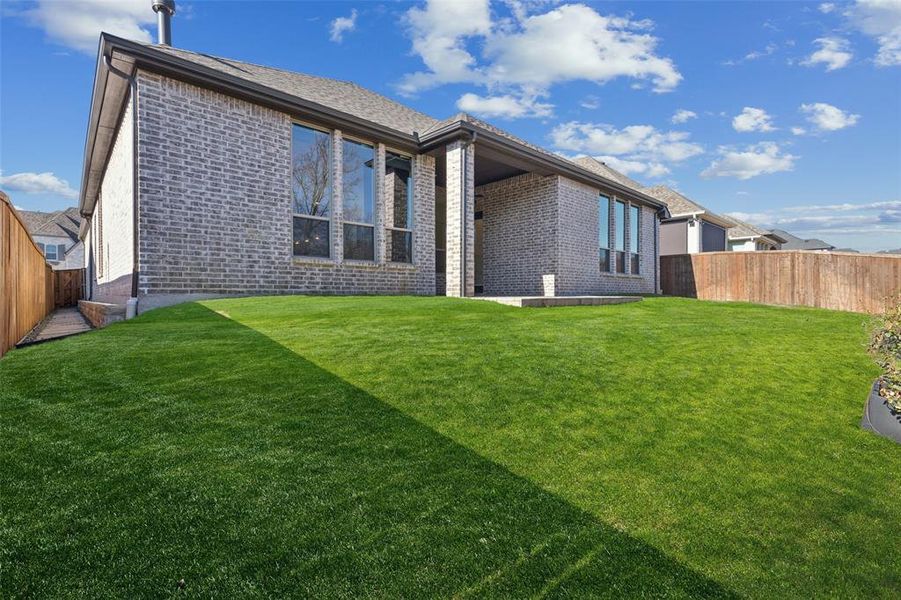 Exterior details and patio area of a home in , Aubrey (Image 3).