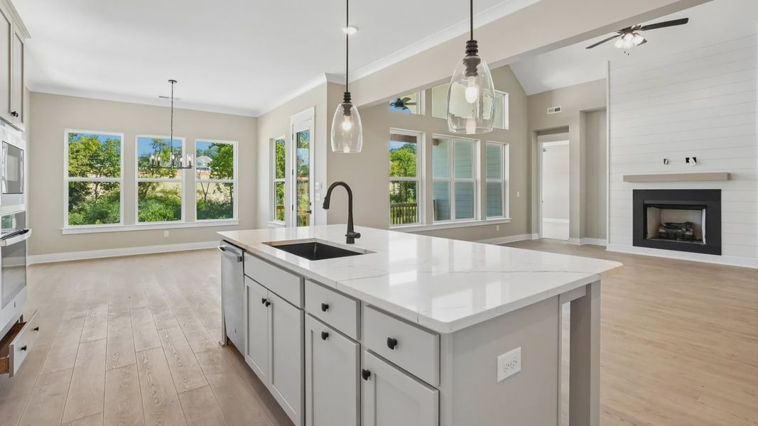 Kitchen with island paired with sink and dishwasher