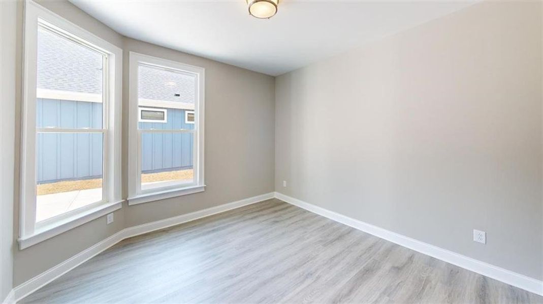Spacious, unfurnished interior of a new home in The Courtyards at Redbud Lane, Holly Springs (Image 26).