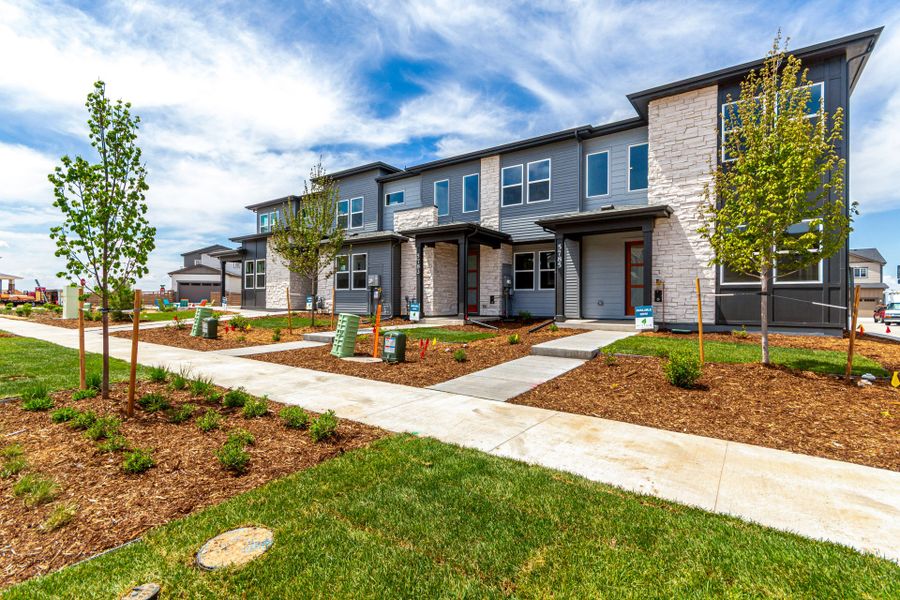 Front exterior of a new home in Painted Prairie, Aurora, CO, highlighting curb appeal (Image 2).