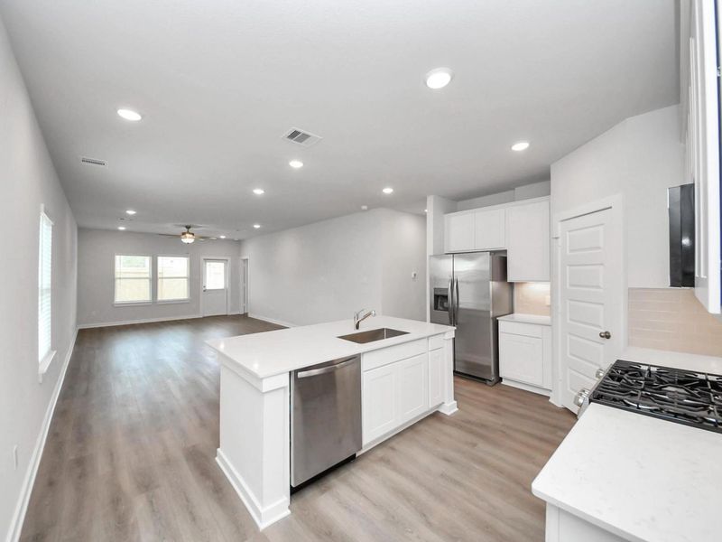 Furnished interior view inside a new home in Caney Creek Place, Conroe (Image 4).