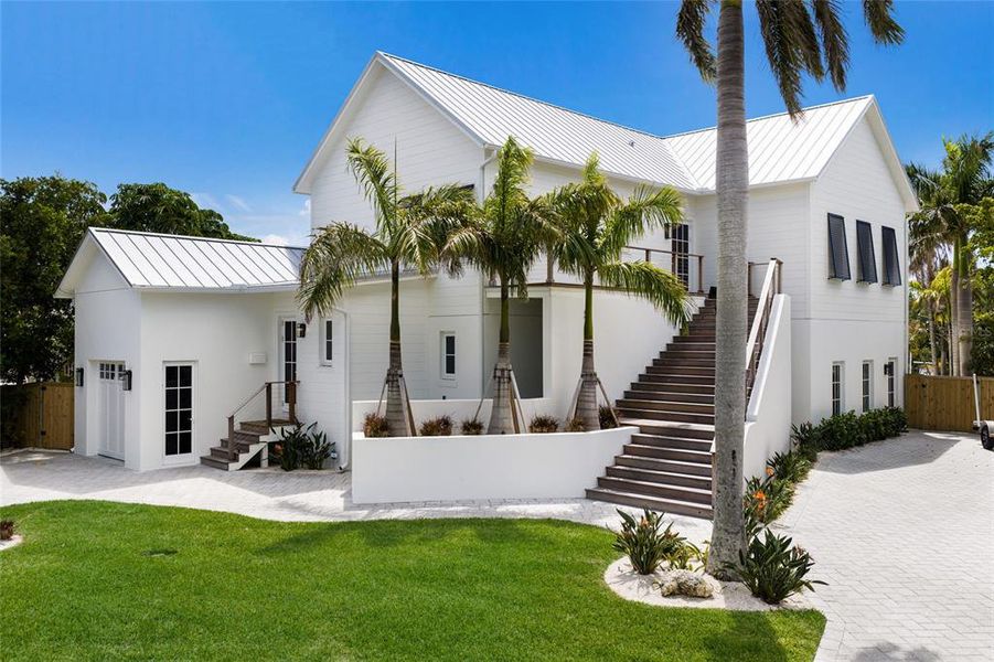 Front exterior of a new home in , Bradenton Beach, FL, highlighting curb appeal (Image 22).