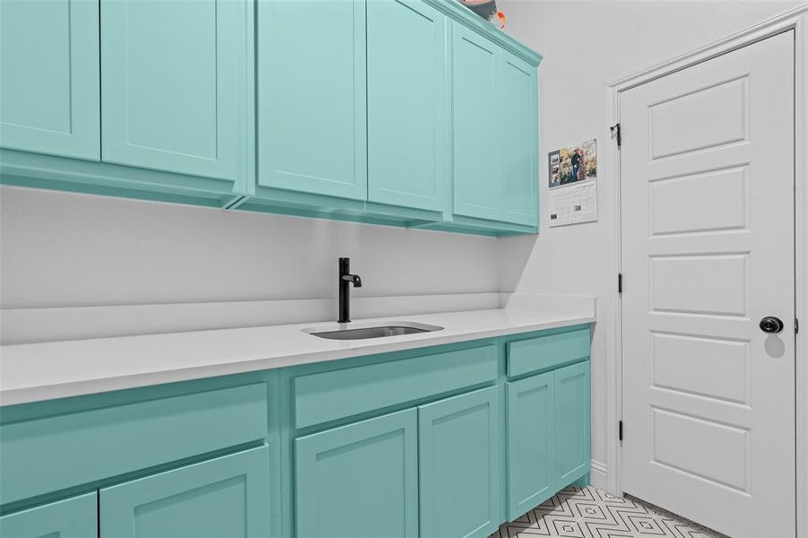 Laundry room featuring sink