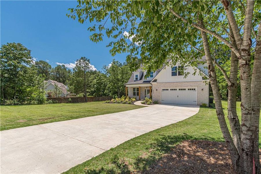 Front exterior of a new home in , McDonough, GA, highlighting curb appeal (Image 23).