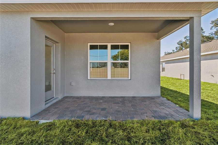 Exterior details and patio area of a home in Aspire at Canter Creek, Davenport (Image 3).